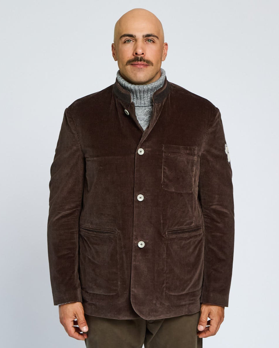Man wearing a brown jacket on a white background