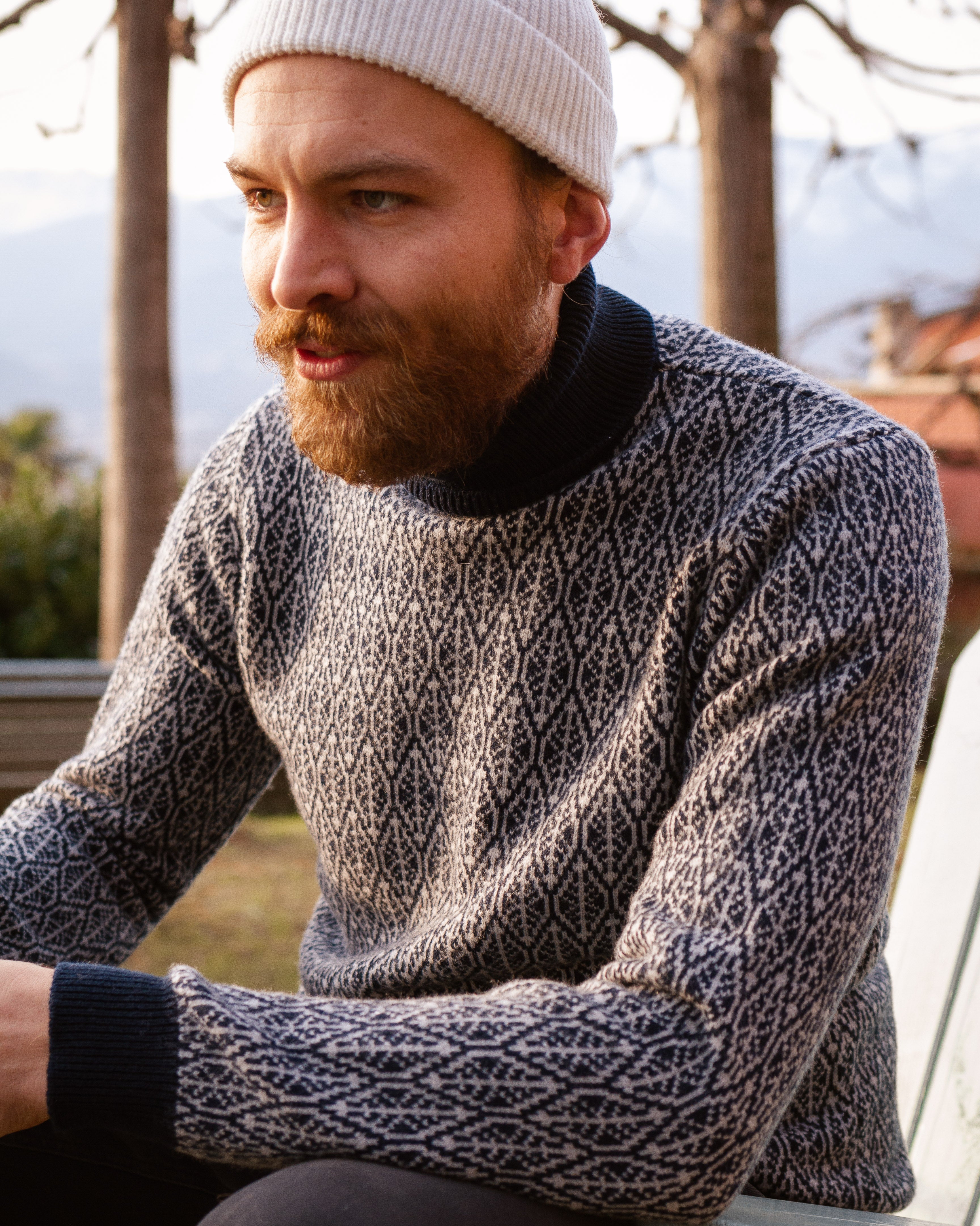Merino Wool Sweater | Turtleneck | Blue and Grey | Leaf Pattern | Runes | Sustainable | Nature | Emotional Shot | Outdoor Shot 